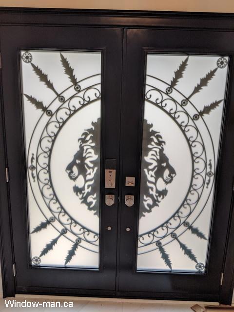 Front exterior doors. Double entry steel insulated. Painted black. Full wrought iron glass inserts. Forest King Lions iron glass design. This is inside view of the pic 1091